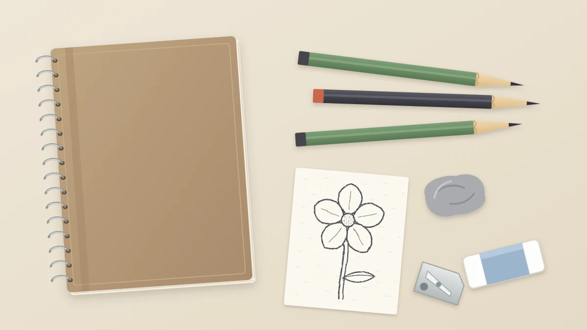 Flat lay on a cream desk of three graphite pencils, a kneaded eraser, a white block eraser, a metal sharpener and a closed spiral sketchbook